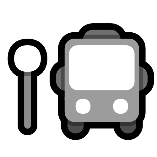 a grey bus next to a circular roadsign.